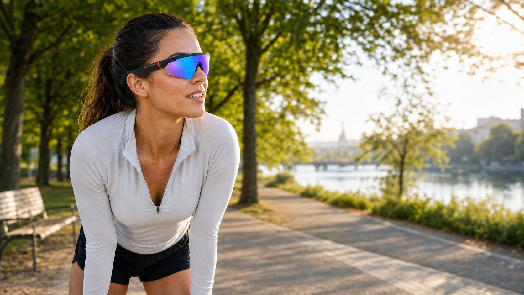 Runner wearing Bluetooth open-ear sport sunglasses in a park
